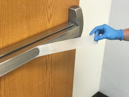 2" SharkletShield germ barrier tape applied to a door push bar
